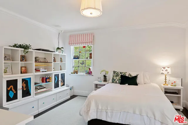 a view of a kitchen with a dining table and chairs
