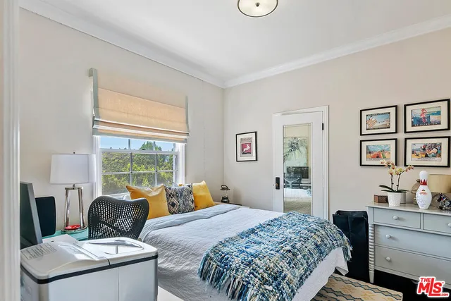 a view of a house with backyard sitting area and garden