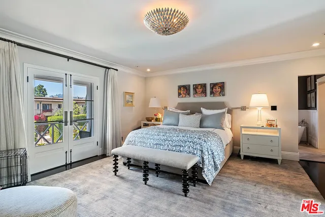 a view of a house with potted plants and a bench