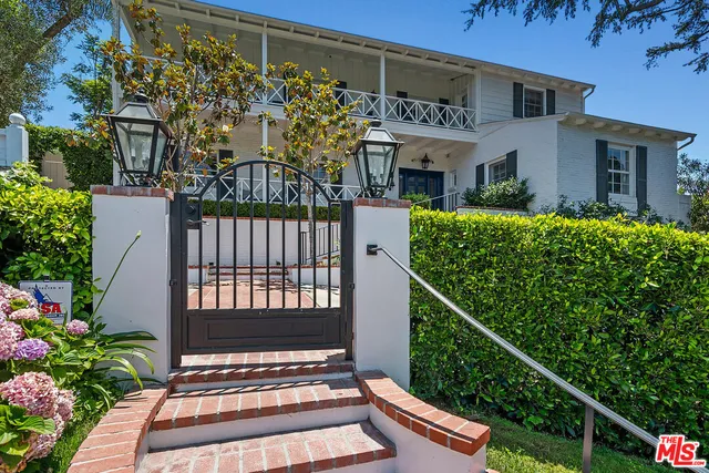 a living room with furniture and fireplace