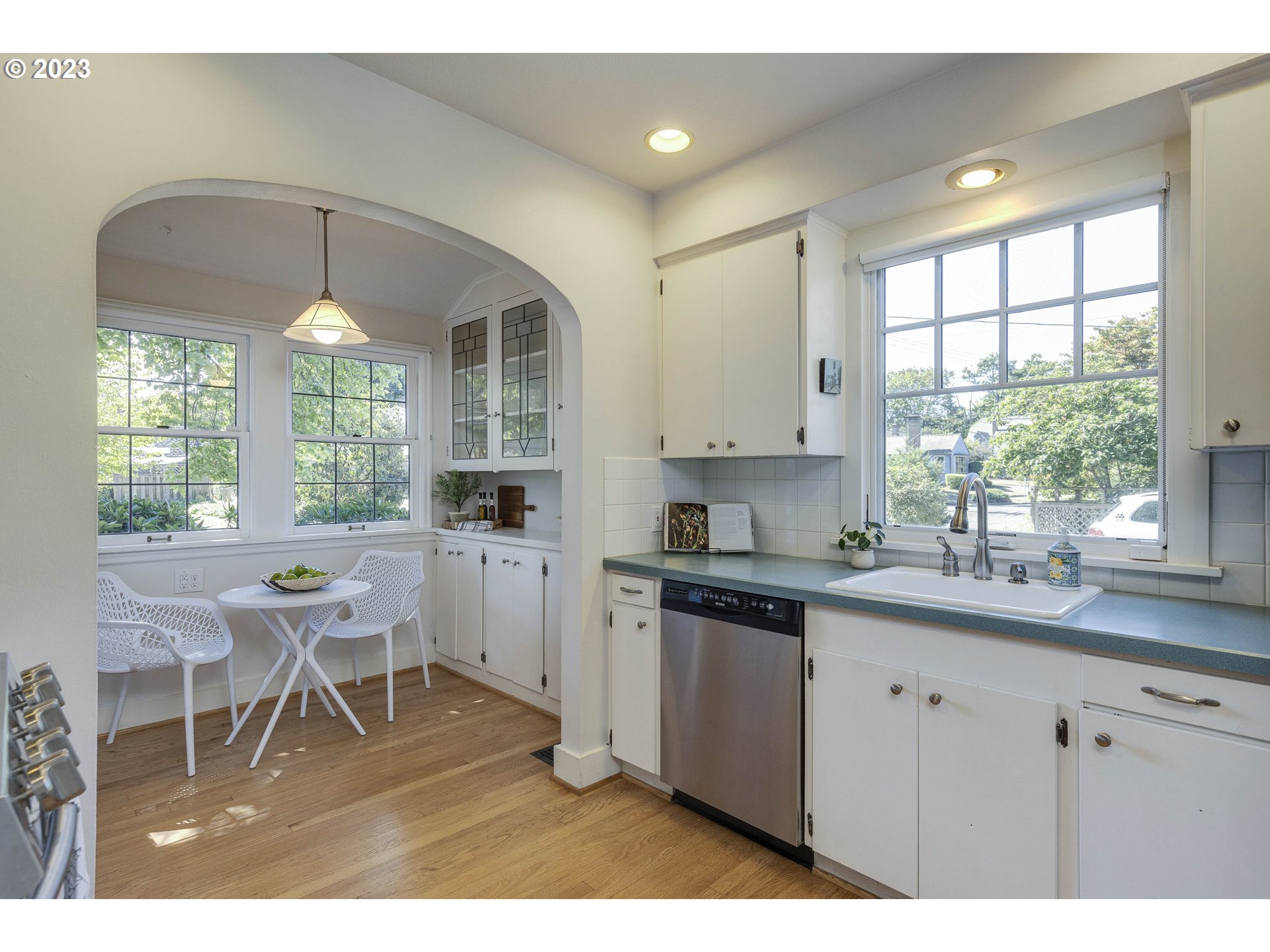 3227 Southeast Lambert Street Portland, OR 97202 - Photo 15 of 44 a kitchen with a sink cabinets and window