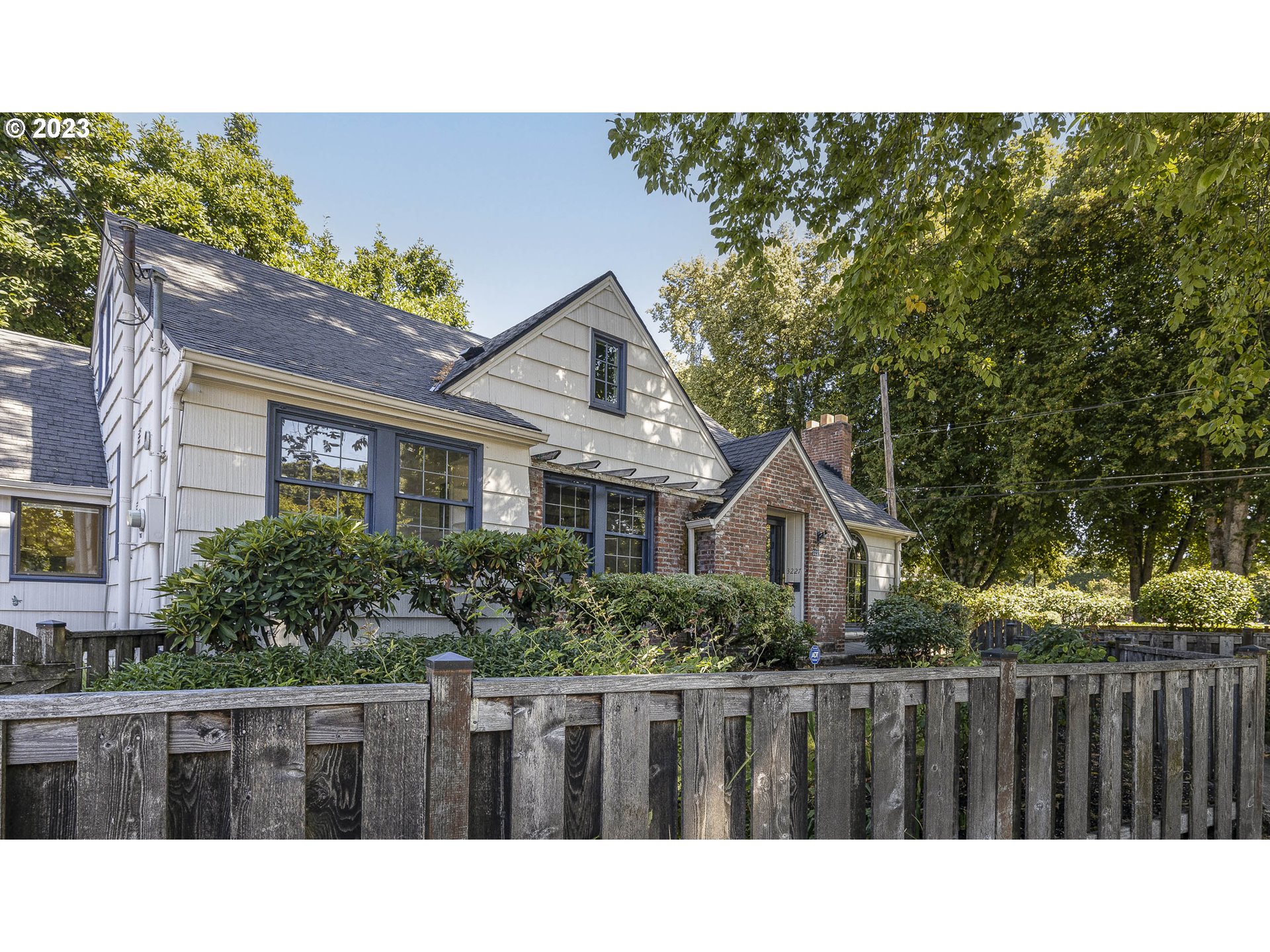 3227 Southeast Lambert Street Portland, OR 97202 - Photo 2 of 44 a black and white photo of a house