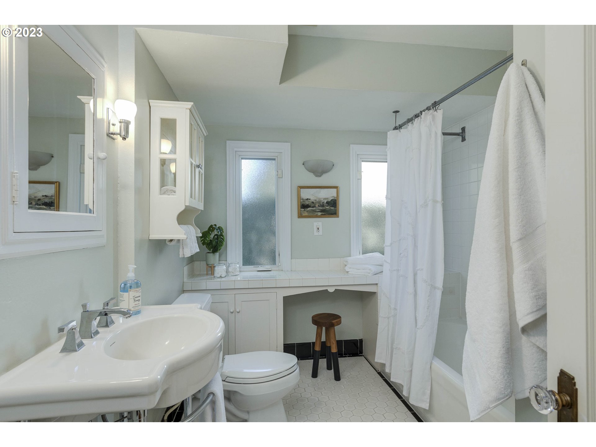 3227 Southeast Lambert Street Portland, OR 97202 - Photo 26 of 44 a bathroom with a sink vanity mirror and toilet