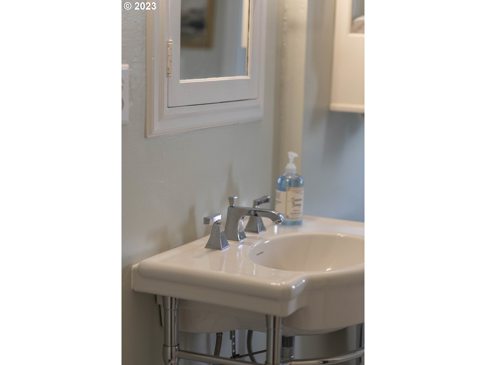 3227 Southeast Lambert Street Portland, OR 97202 - Photo 27 of 44 a bathroom with a sink and a mirror