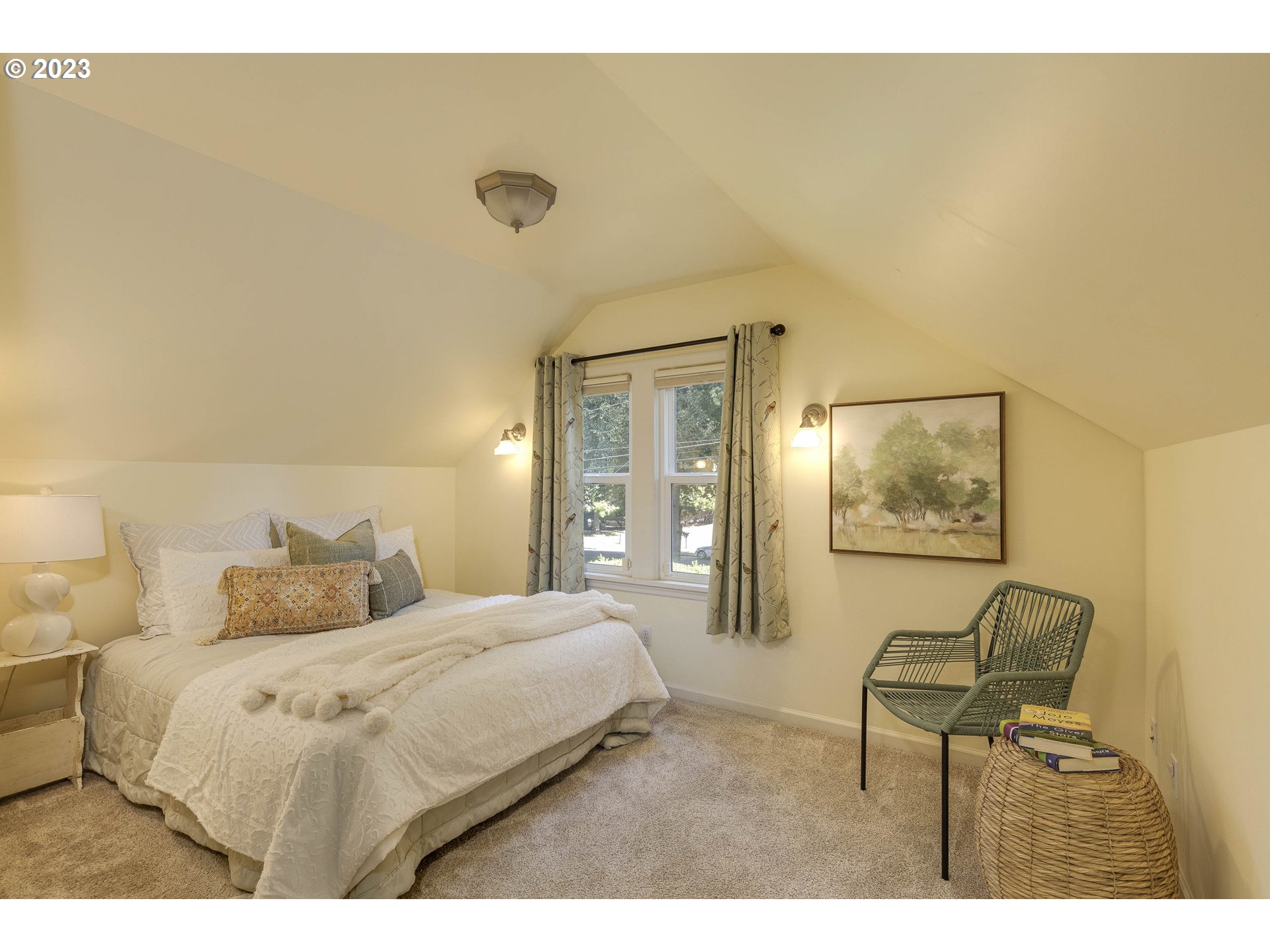 3227 Southeast Lambert Street Portland, OR 97202 - Photo 30 of 44 a bedroom with a bed and a painting on the wall