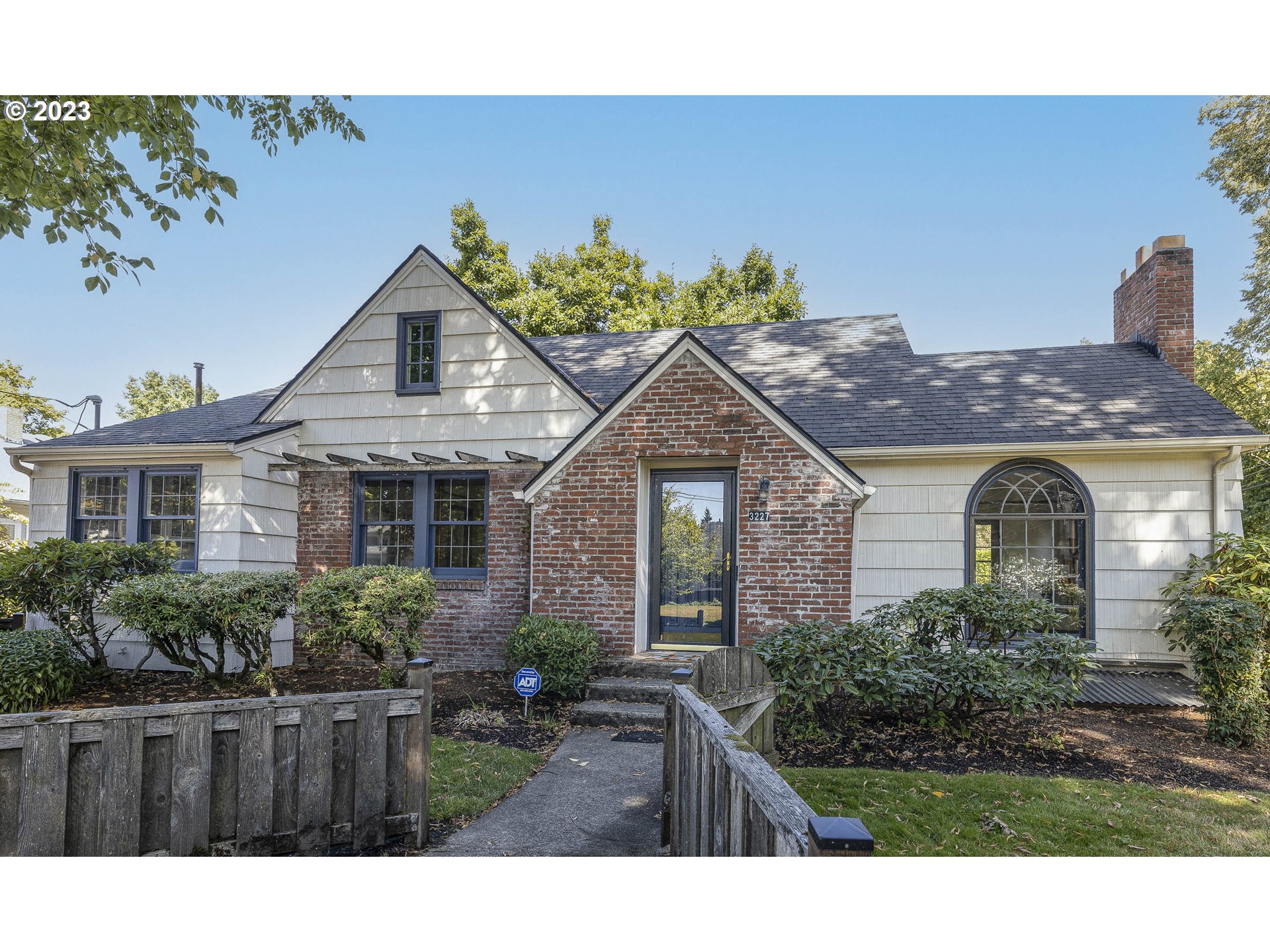 3227 Southeast Lambert Street Portland, OR 97202 - Photo 3 of 44 a view of a front of house with a yard