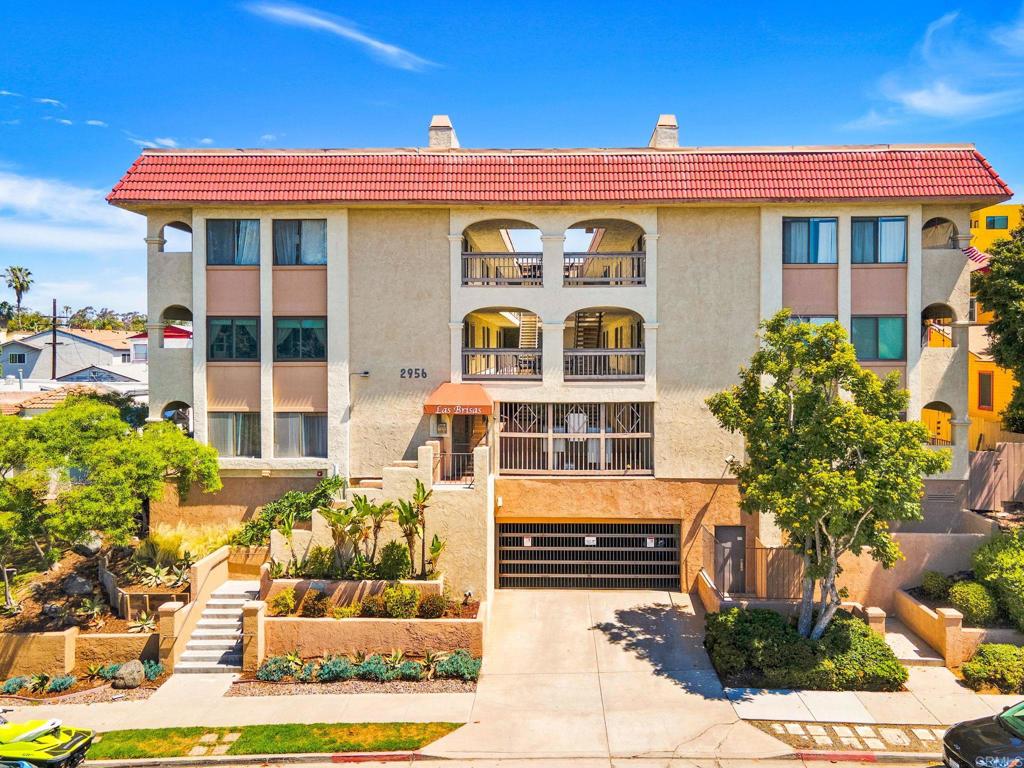 2956 C Street, Unit 5 San Diego, CA 92102 - Photo 1 of 35 a front view of a house with a yard