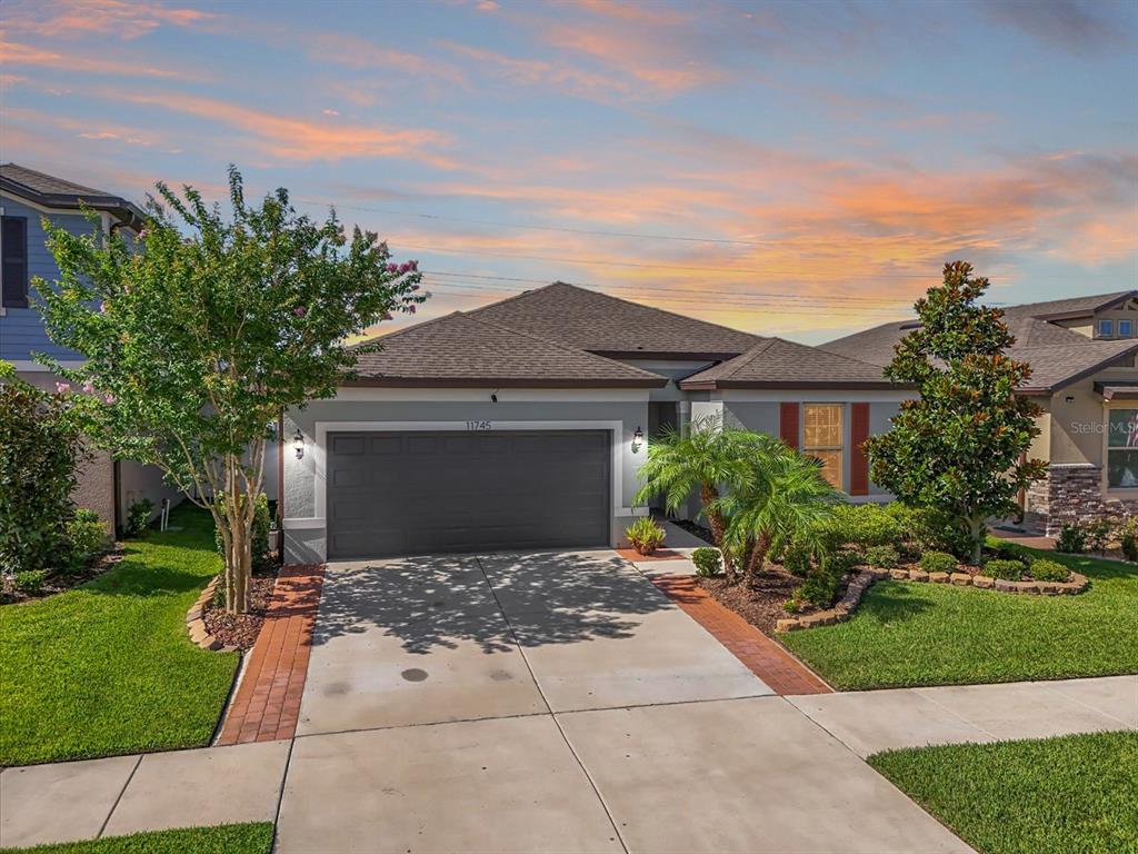 front view of a house with a yard