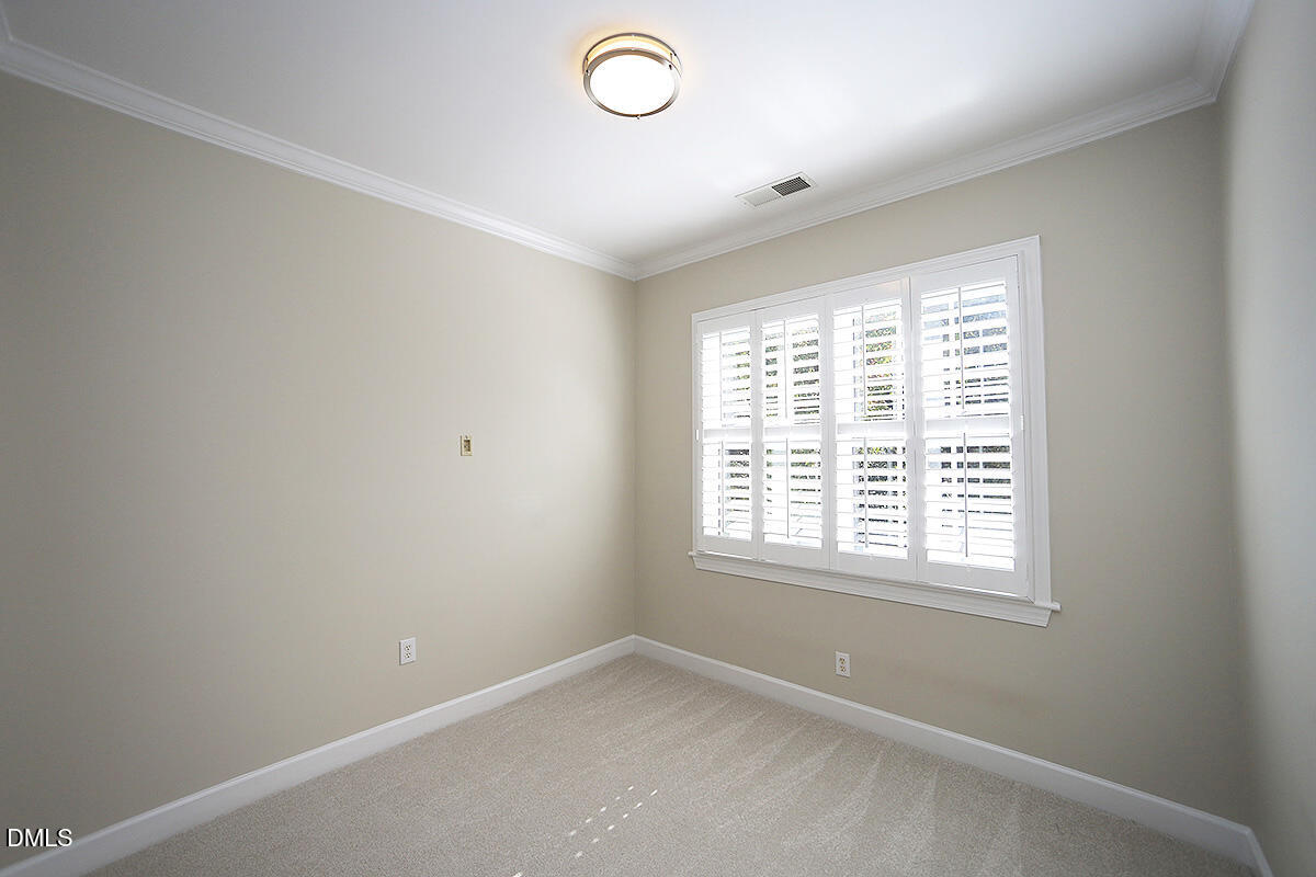 100 Northbrook Drive, Unit 207 Raleigh, NC 27609 - Photo 19 of 39 an empty room with a window