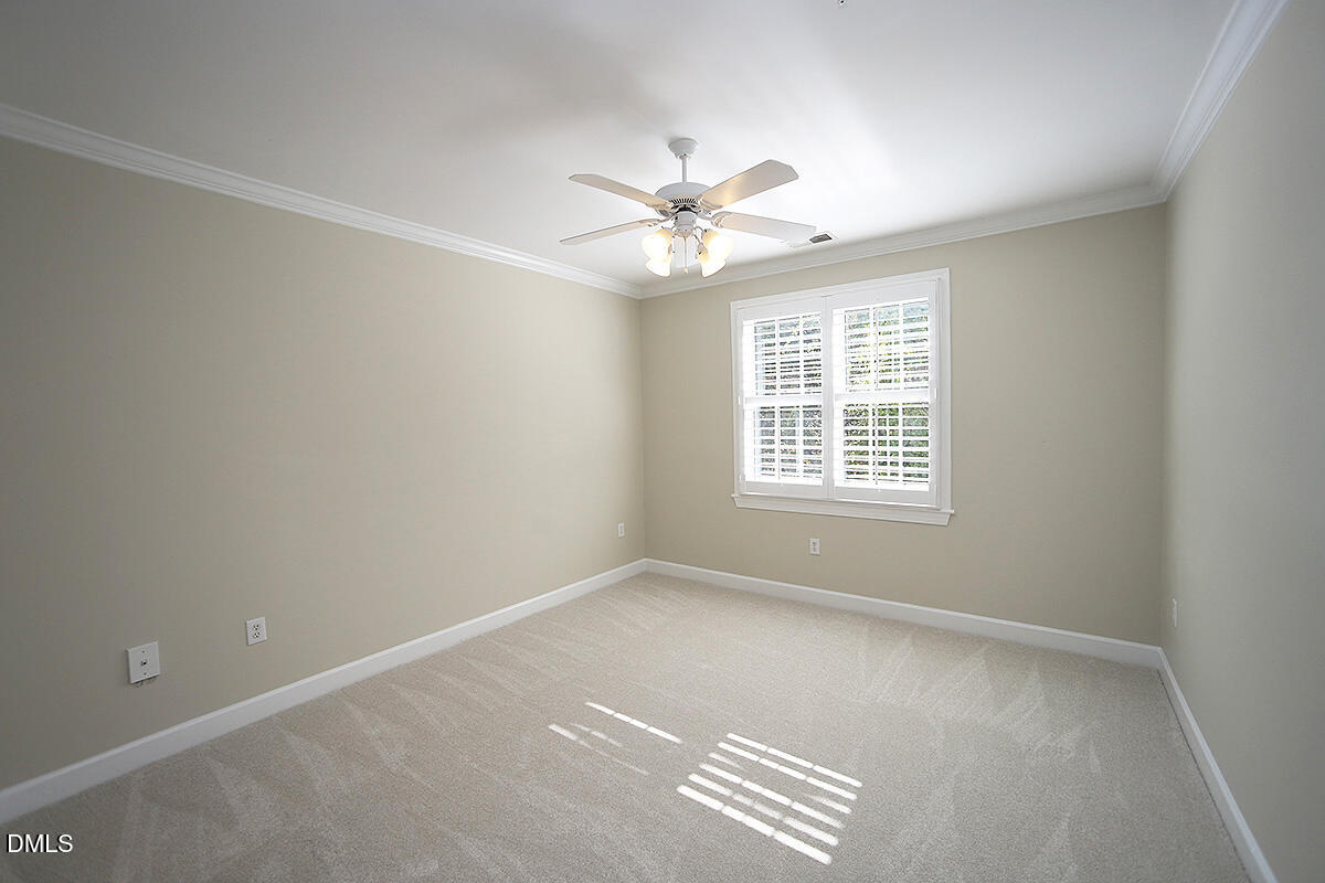 100 Northbrook Drive, Unit 207 Raleigh, NC 27609 - Photo 22 of 39 an empty room with windows and fan