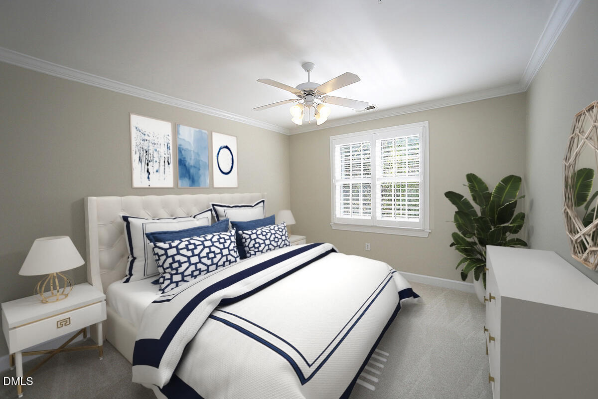 100 Northbrook Drive, Unit 207 Raleigh, NC 27609 - Photo 23 of 39 a bedroom with a large bed and a chandelier