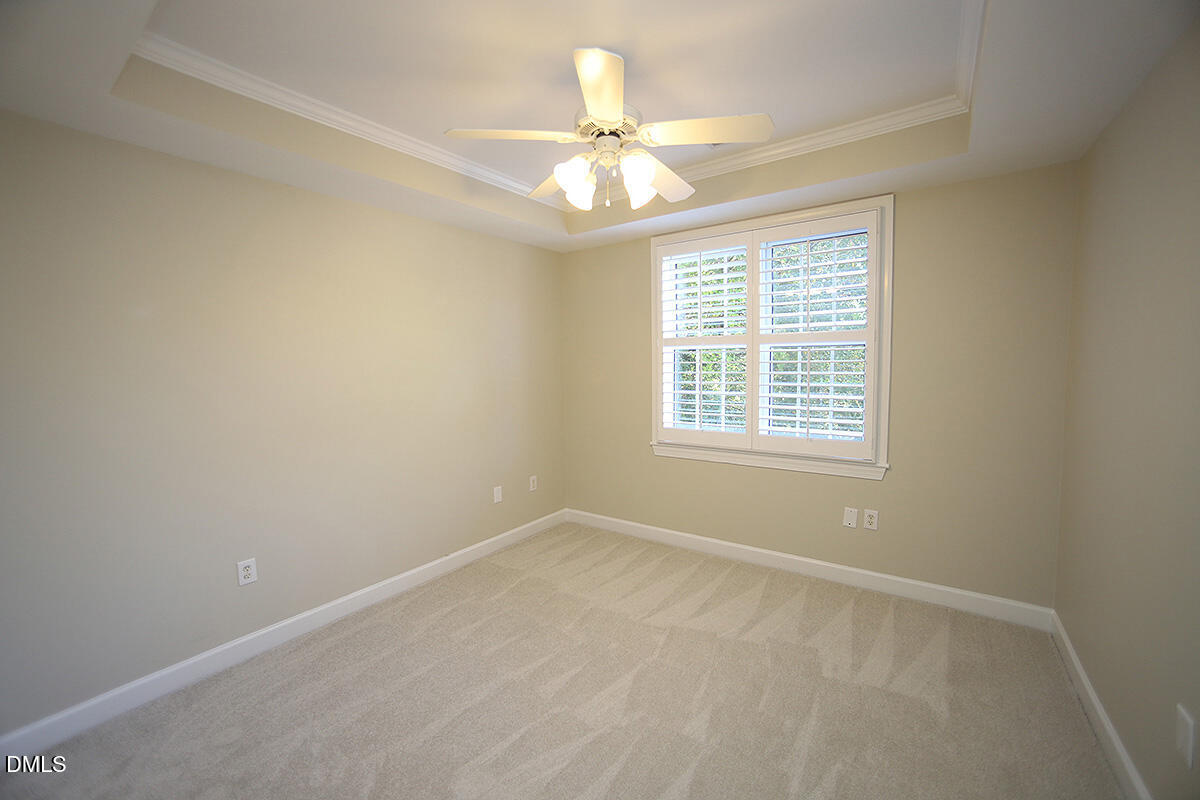 100 Northbrook Drive, Unit 207 Raleigh, NC 27609 - Photo 26 of 39 an empty room with a window and a ceiling fan