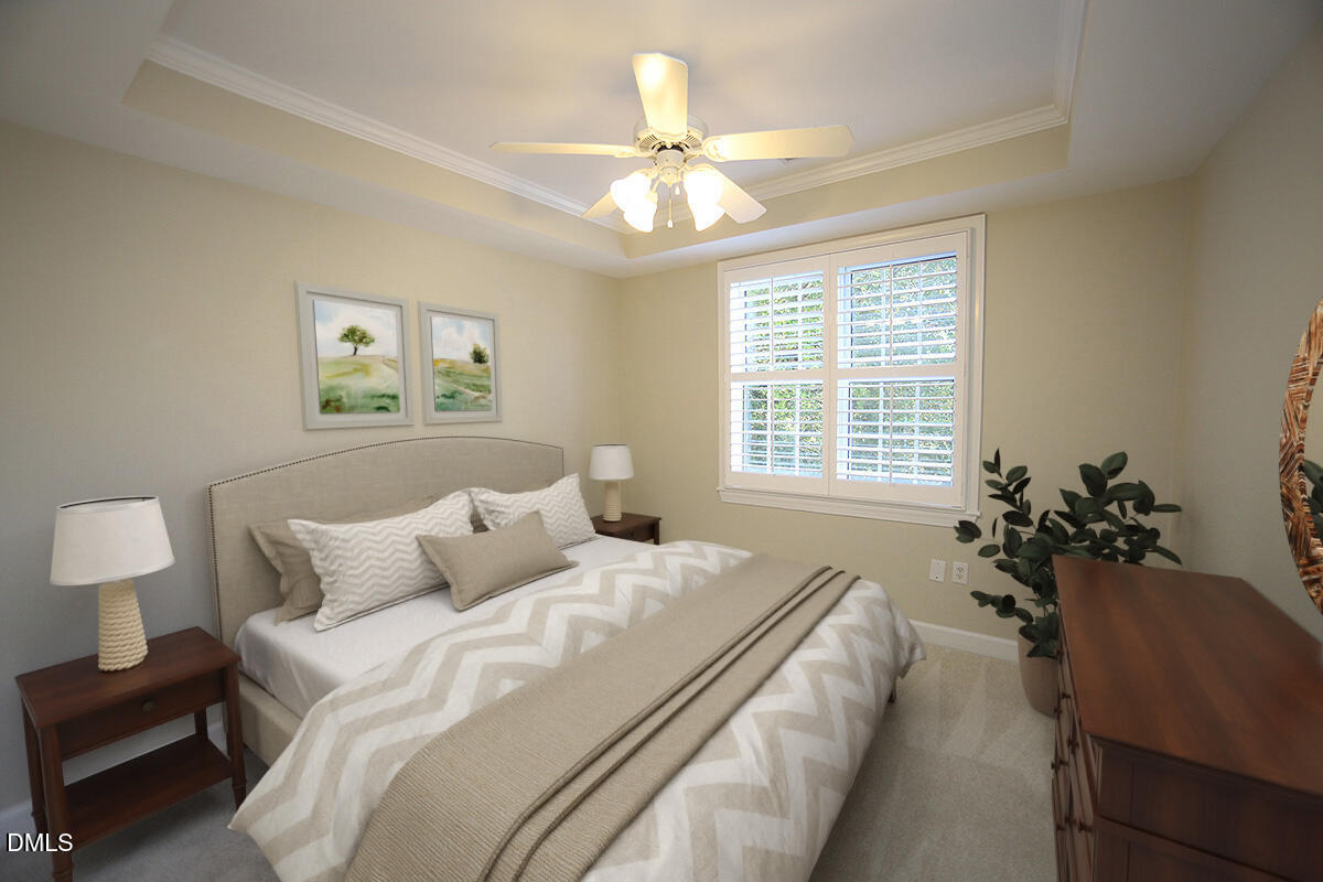 100 Northbrook Drive, Unit 207 Raleigh, NC 27609 - Photo 27 of 39 a bedroom with a bed and a chandelier