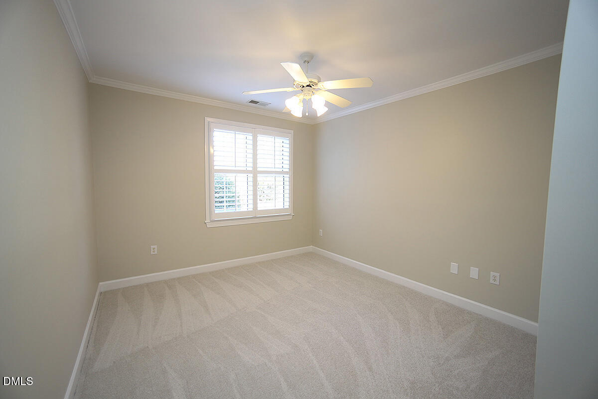 100 Northbrook Drive, Unit 207 Raleigh, NC 27609 - Photo 28 of 39 an empty room with a window and a fan