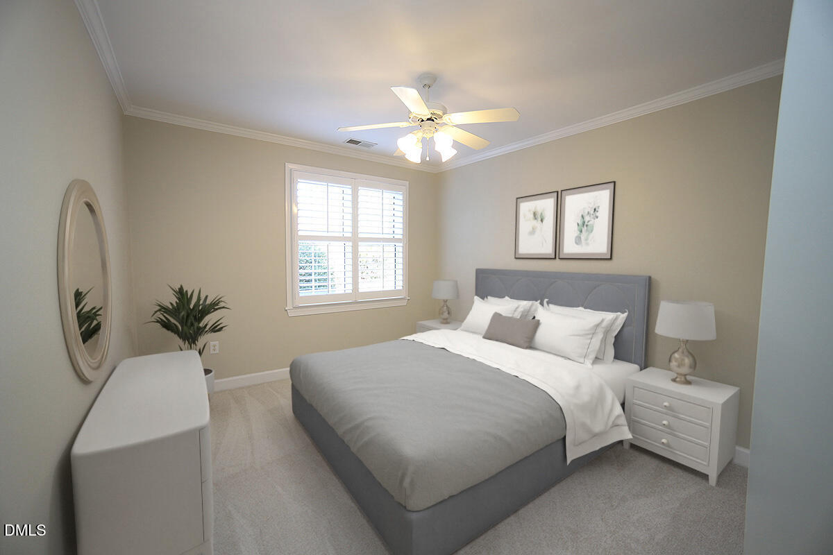100 Northbrook Drive, Unit 207 Raleigh, NC 27609 - Photo 29 of 39 a bedroom with a large bed and a chandelier