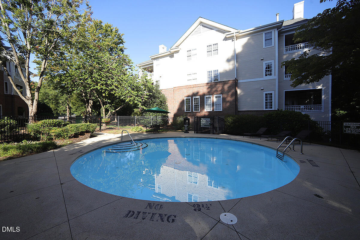 100 Northbrook Drive, Unit 207 Raleigh, NC 27609 - Photo 36 of 39 a view of a swimming pool with a patio