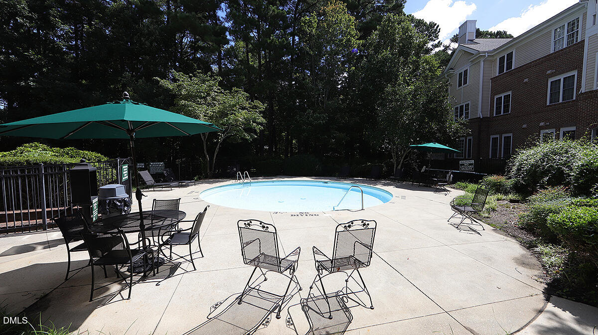 100 Northbrook Drive, Unit 207 Raleigh, NC 27609 - Photo 37 of 39 a view of backyard with outdoor seating and trees