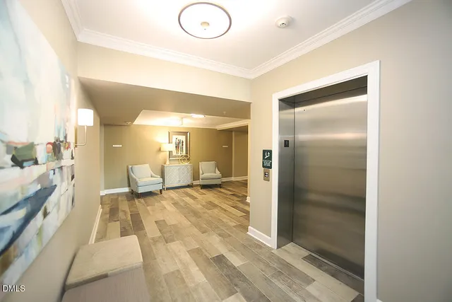 a view of a big room with closet and wooden door
