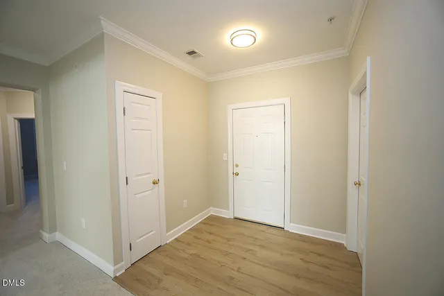 a view of a livingroom with a fireplace and a ceiling fan