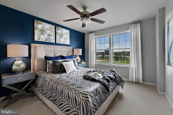 a bedroom with bed and window