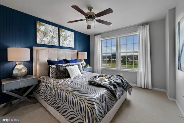 a bedroom with bed and window