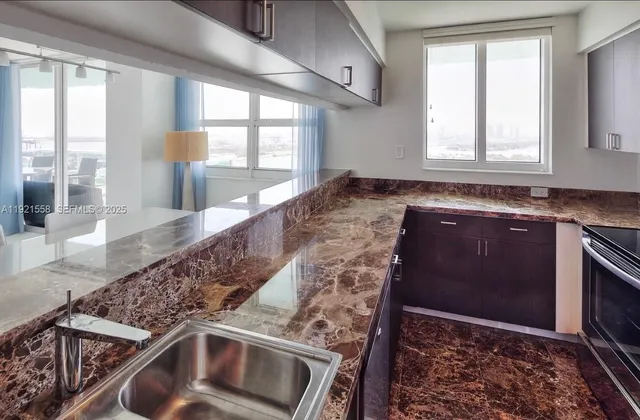 a kitchen with a sink and a stove