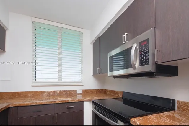 a kitchen that has a sink and a window