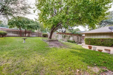 a view of a backyard with a small cabin
