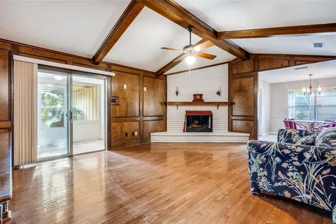 a view of a livingroom with fireplace and furniture
