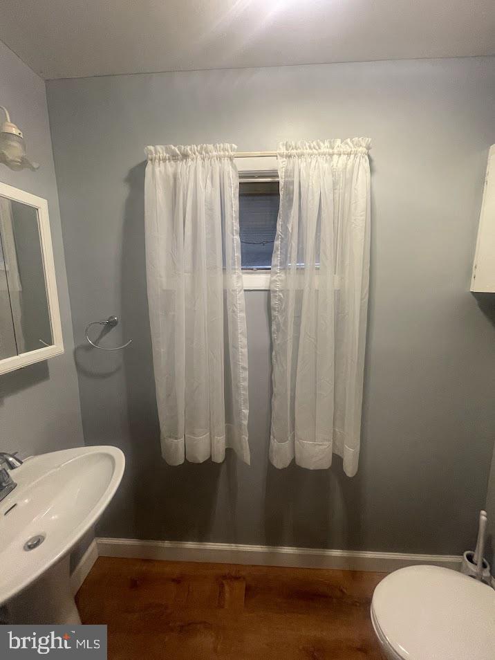 202 Gumboro Road Selbyville, DE 19975 - Photo 12 of 22 a bathroom with a toilet and a shower