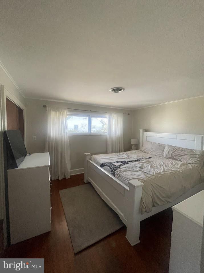 202 Gumboro Road Selbyville, DE 19975 - Photo 8 of 22 a bedroom with a bed and a mirror