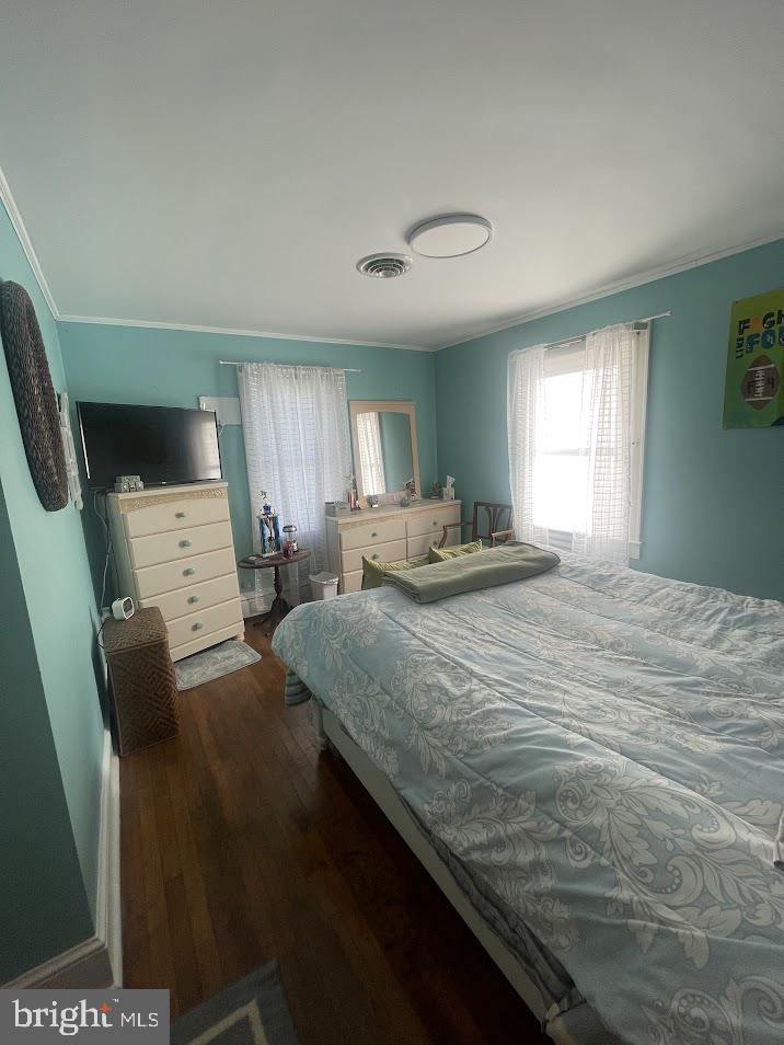 202 Gumboro Road Selbyville, DE 19975 - Photo 9 of 22 a bedroom with a bed and a flat screen tv