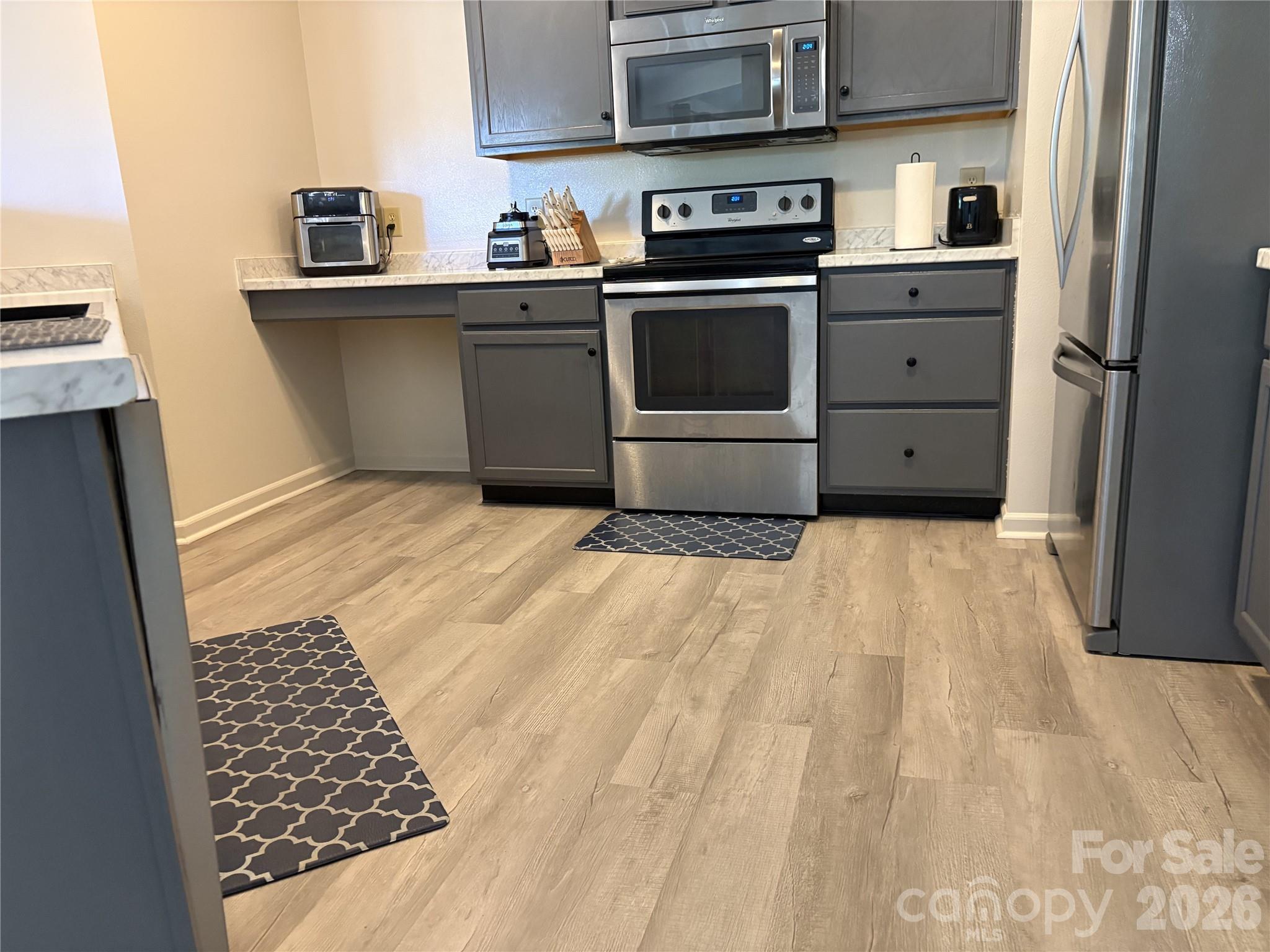 2514 Spring Breeze Way Monroe, NC 28110 - Photo 8 of 25 a kitchen with a cabinets and appliances