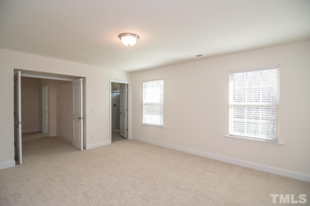 4531 Lord Mario Court Raleigh, NC 27610 - Photo 11 of 27 an empty room with windows