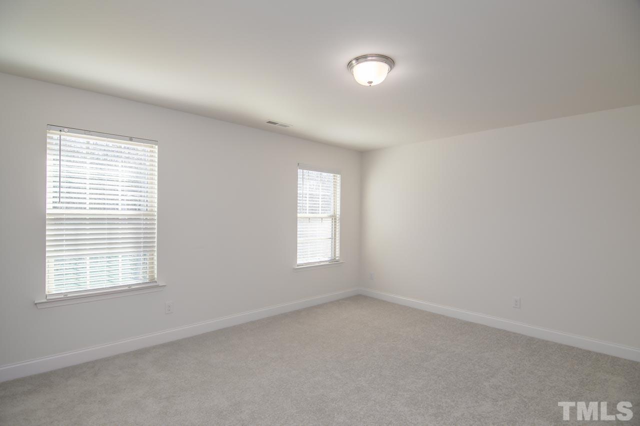 4531 Lord Mario Court Raleigh, NC 27610 - Photo 12 of 27 an empty room with windows