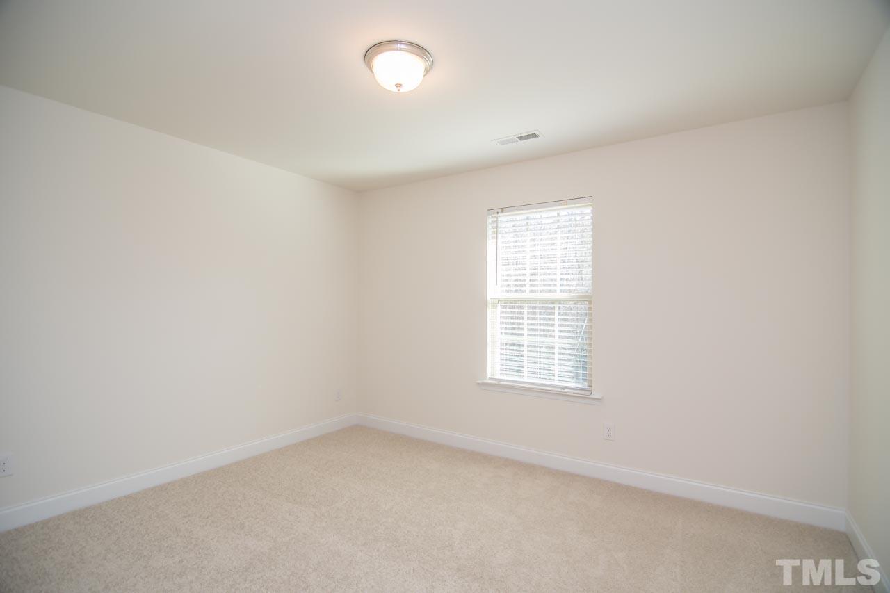 4531 Lord Mario Court Raleigh, NC 27610 - Photo 15 of 27 an empty room with a window
