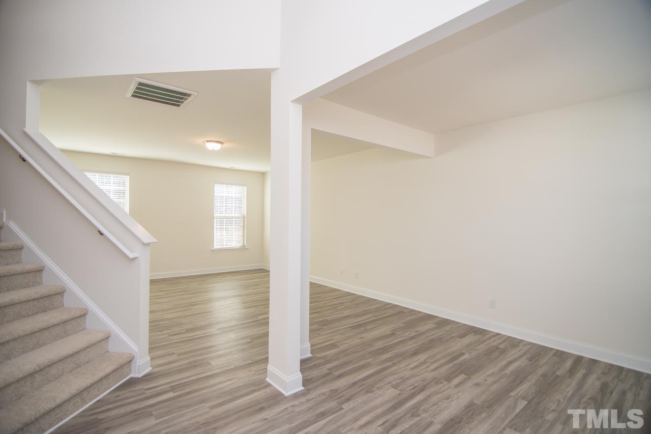 4531 Lord Mario Court Raleigh, NC 27610 - Photo 2 of 27 a view of empty room with wooden floor