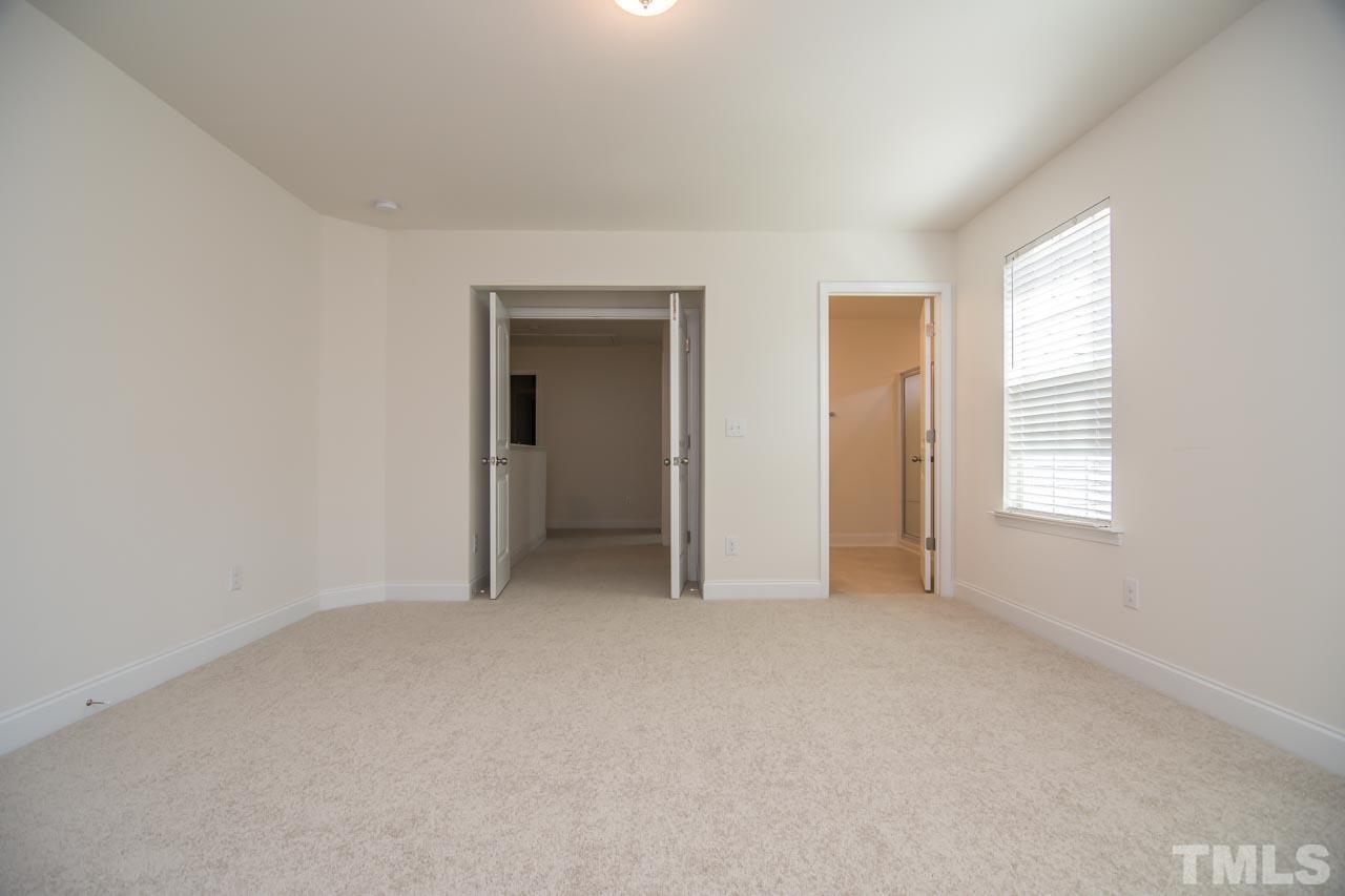 4531 Lord Mario Court Raleigh, NC 27610 - Photo 21 of 27 an empty room with windows and closet