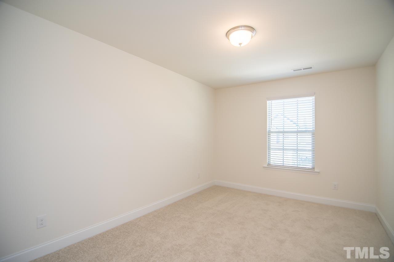 4531 Lord Mario Court Raleigh, NC 27610 - Photo 22 of 27 an empty room with a window