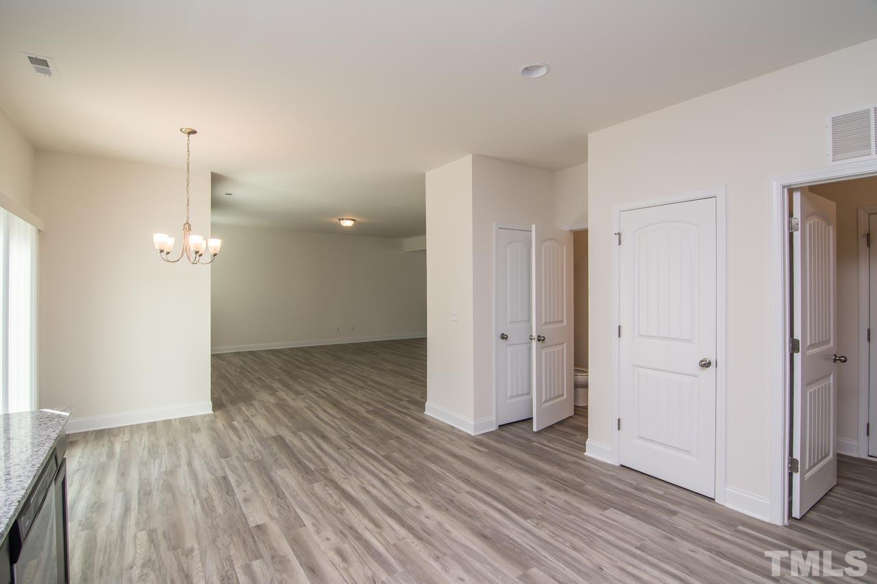 4531 Lord Mario Court Raleigh, NC 27610 - Photo 9 of 27 a view of a room with wooden floor and a bathroom