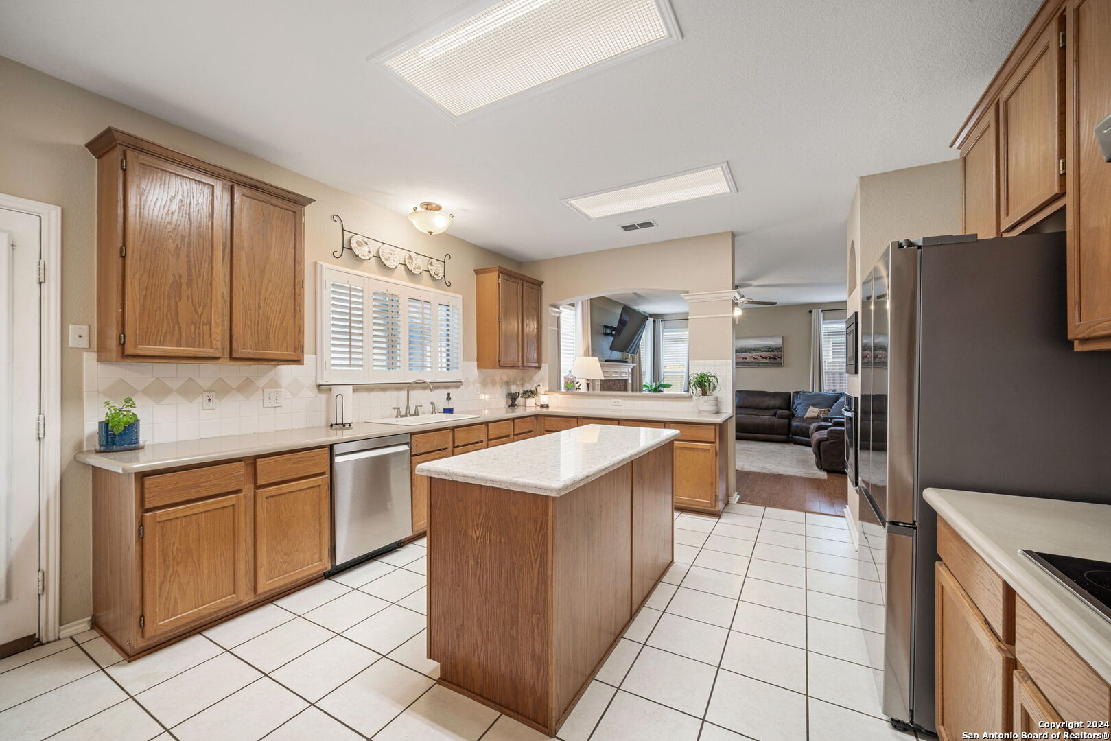 16323 Rangerider San Antonio, TX 78247 - Photo 13 of 36 a kitchen with stainless steel appliances granite countertop a sink counter space and cabinets