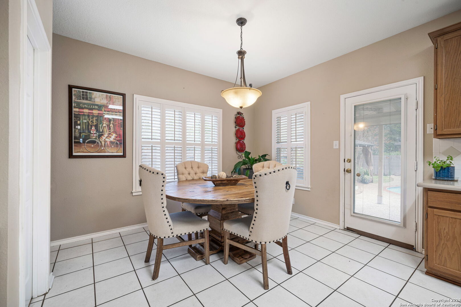 16323 Rangerider San Antonio, TX 78247 - Photo 14 of 36 a view of a dining room with furniture and window