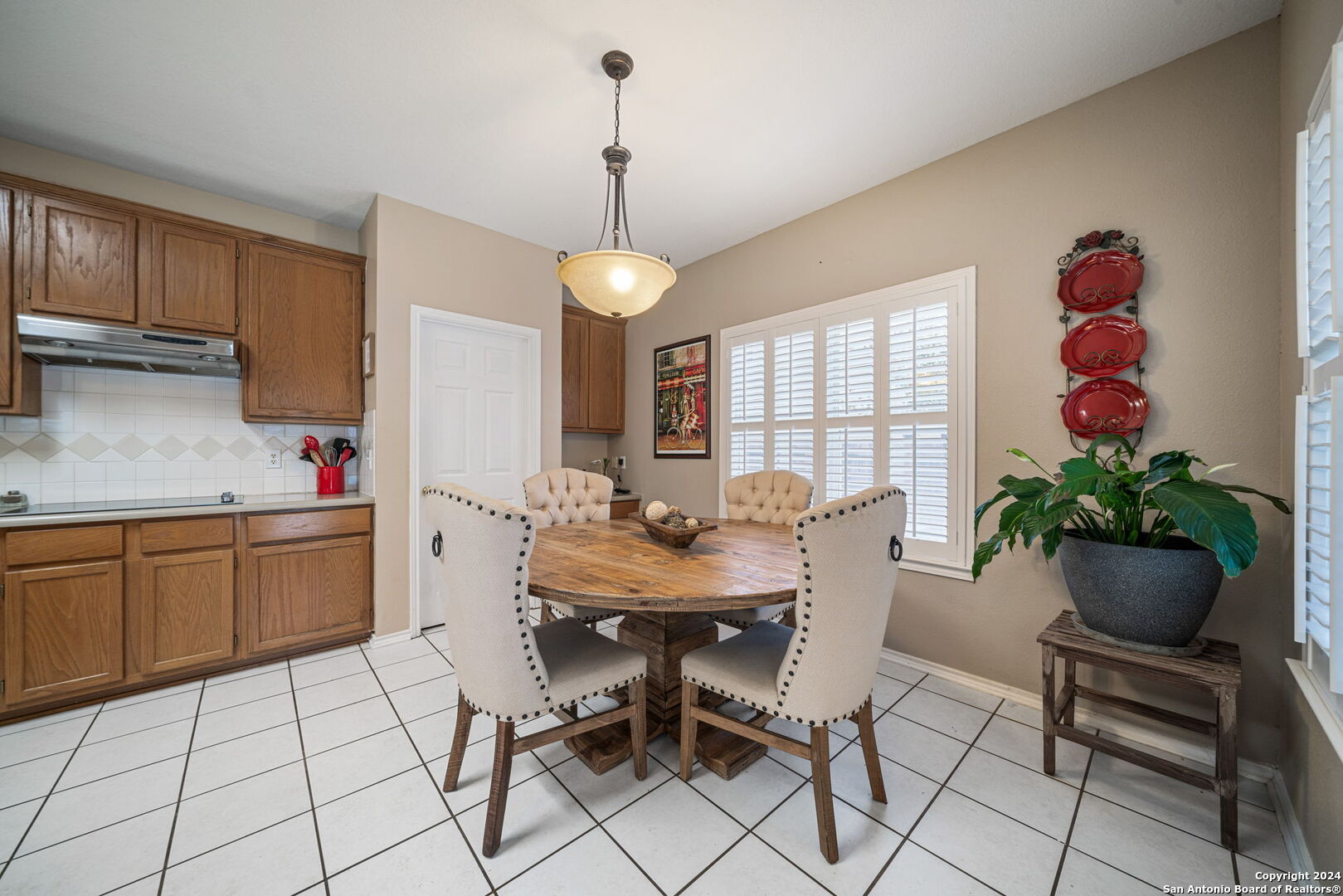 16323 Rangerider San Antonio, TX 78247 - Photo 15 of 36 a view of a dining room with furniture window and wooden floor
