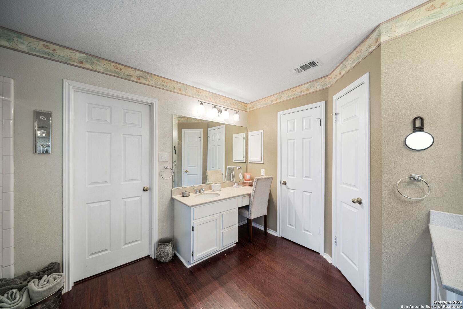 16323 Rangerider San Antonio, TX 78247 - Photo 23 of 36 a view of a bathroom with a sink mirror and wooden floor