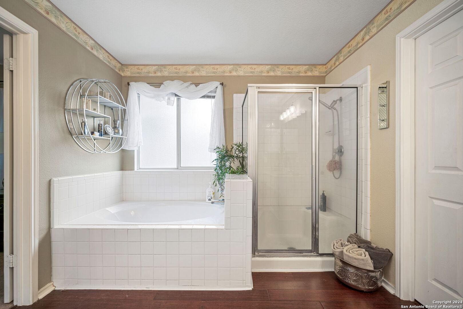 16323 Rangerider San Antonio, TX 78247 - Photo 24 of 36 a bathroom with a tub and shower