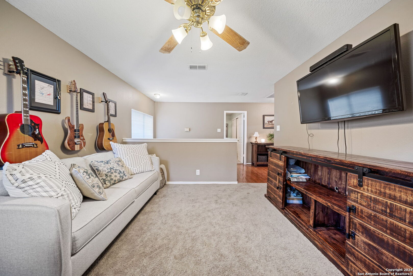 16323 Rangerider San Antonio, TX 78247 - Photo 29 of 36 a living room with furniture and a flat screen tv