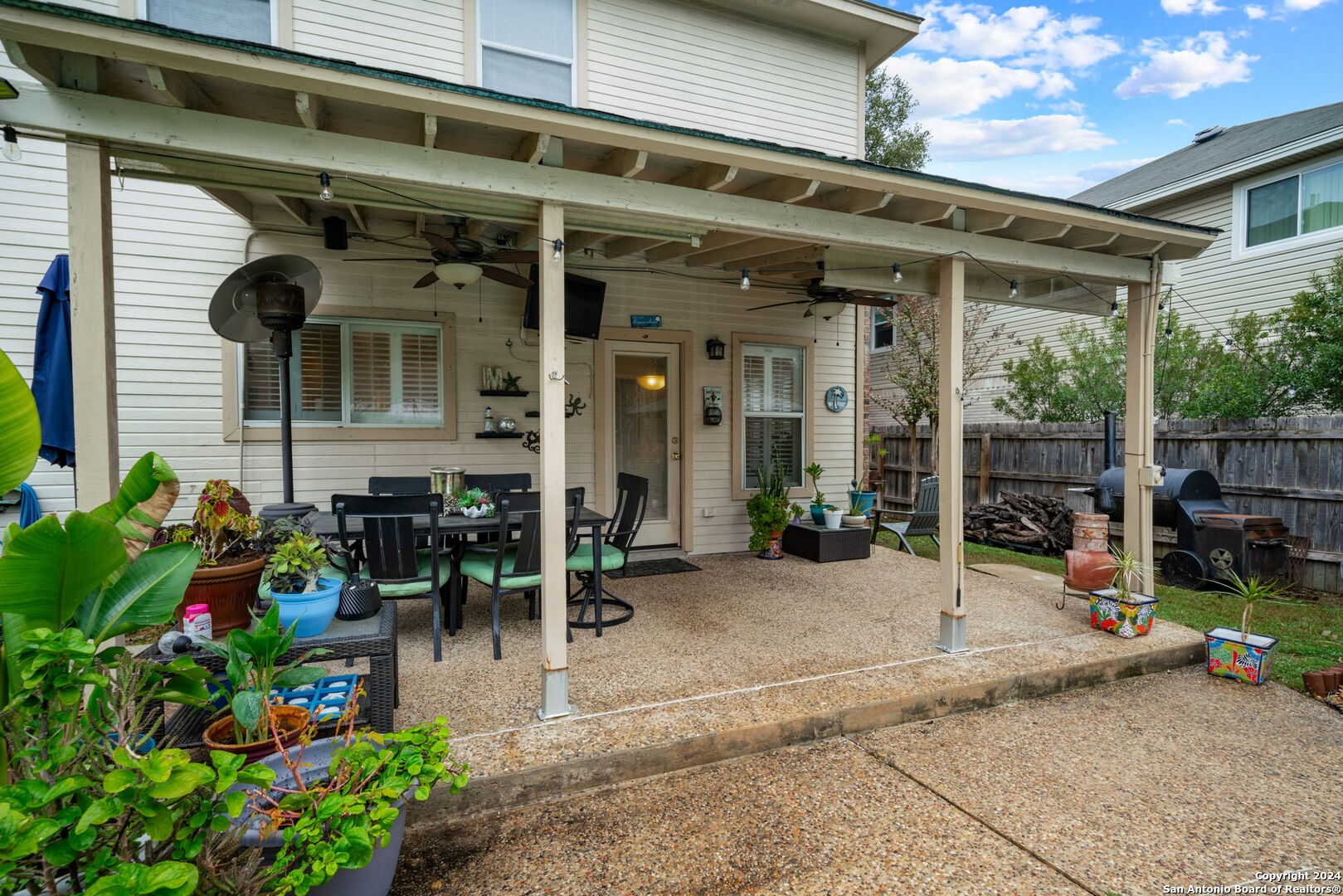16323 Rangerider San Antonio, TX 78247 - Photo 30 of 36 a view of a building with sitting area and potted plants