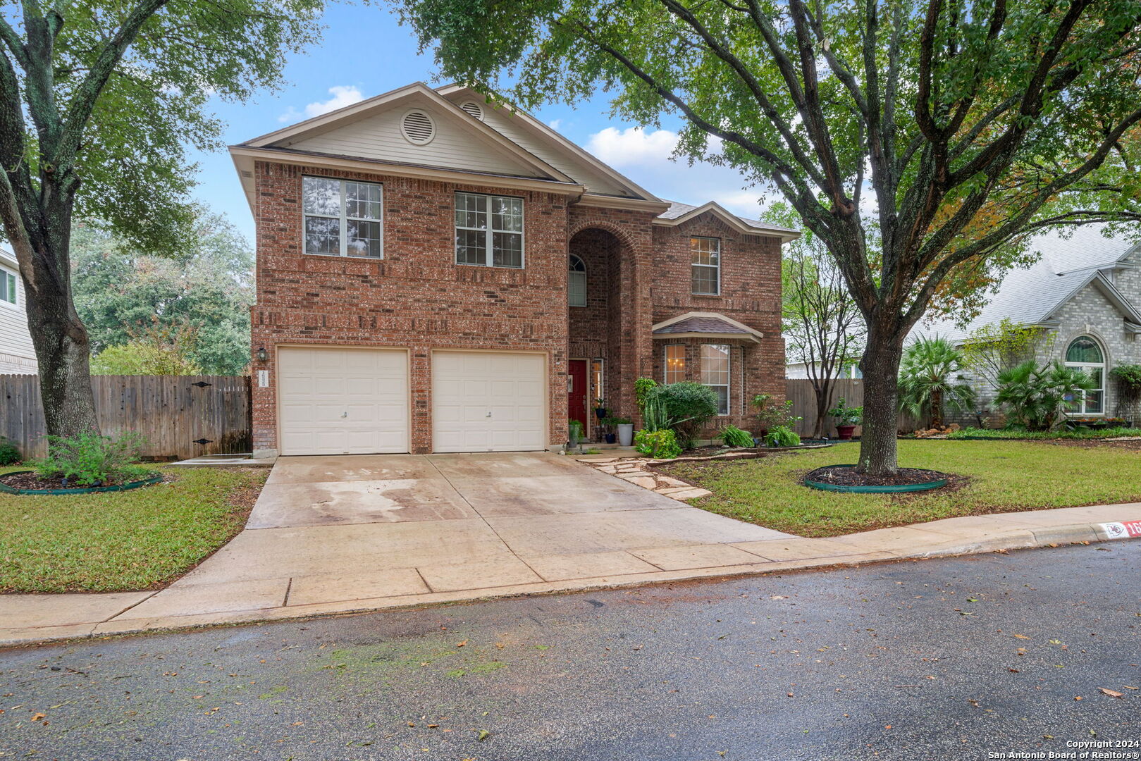 16323 Rangerider San Antonio, TX 78247 - Photo 36 of 36 a front view of a house with a yard and garage