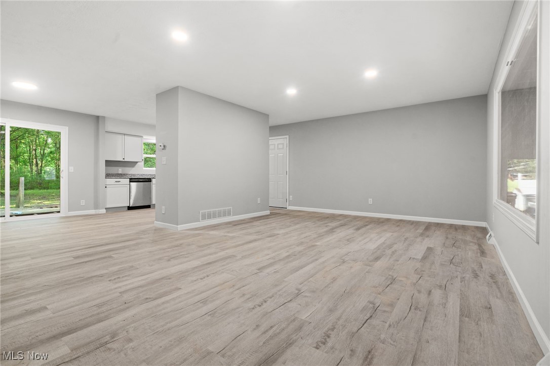 4232 Wilson Avenue Ravenna, OH 44266 - Photo 7 of 28 Unfurnished living room featuring light wood-type flooring and recessed lighting