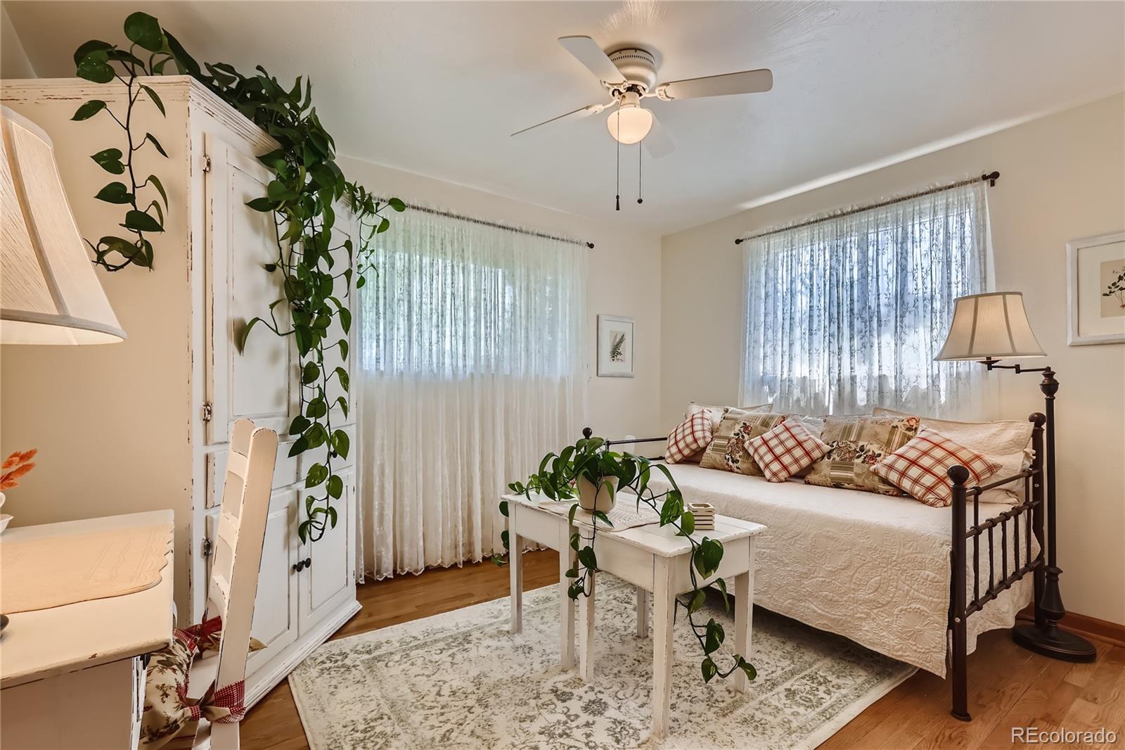 5366 Field Circle Arvada, CO 80002 - Photo 13 of 28 a living room with furniture and a potted plant